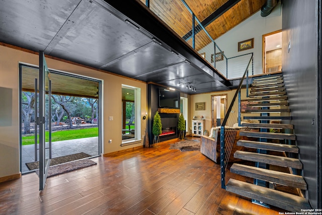 foyer entrance featuring hardwood / wood-style floors, lofted ceiling, and wooden ceiling