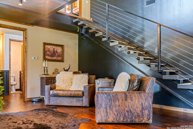 stairs with hardwood / wood-style flooring