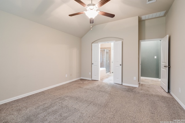 unfurnished bedroom with light carpet, ceiling fan, and lofted ceiling