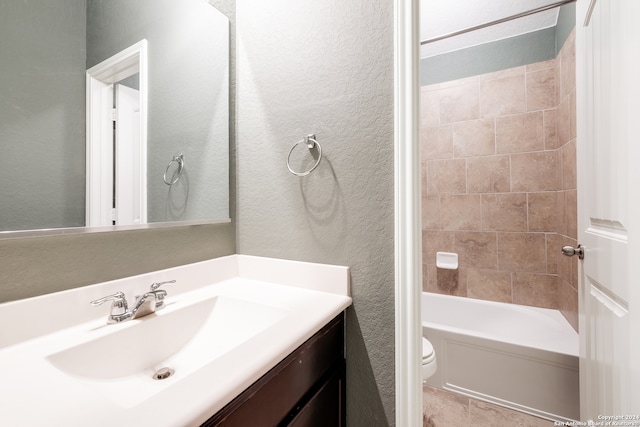 full bathroom with vanity, toilet, and tiled shower / bath