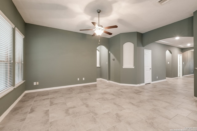 unfurnished room featuring ceiling fan