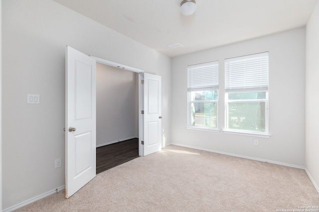 unfurnished bedroom with carpet