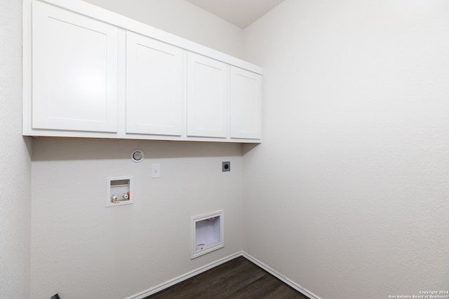 clothes washing area with cabinets, gas dryer hookup, washer hookup, hookup for an electric dryer, and dark hardwood / wood-style flooring