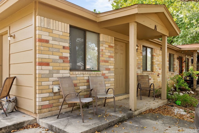 doorway to property with a patio area