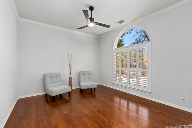 living area featuring ceiling fan, ornamental molding, and hardwood / wood-style flooring