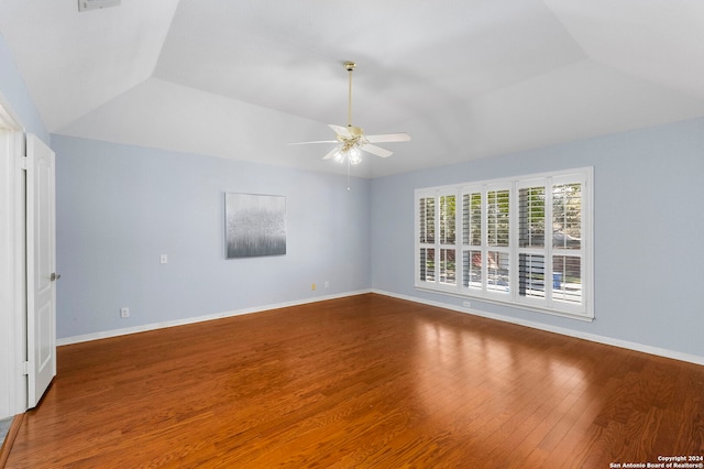 spare room with hardwood / wood-style floors, ceiling fan, and lofted ceiling