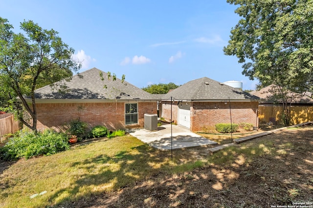 back of property featuring a patio area, a yard, and cooling unit