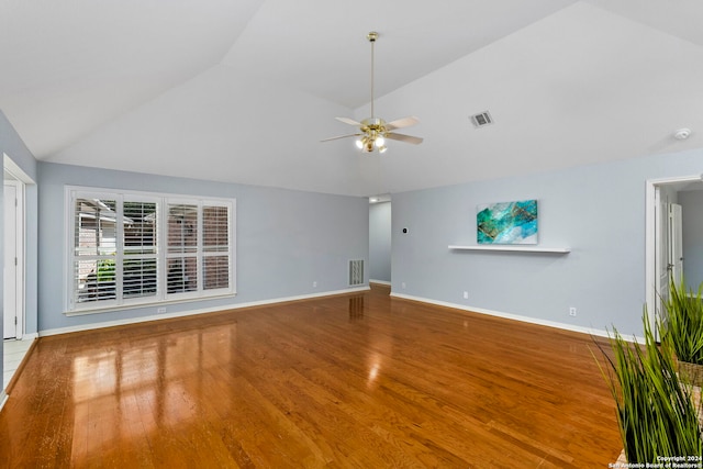 unfurnished living room with ceiling fan, wood-type flooring, and vaulted ceiling