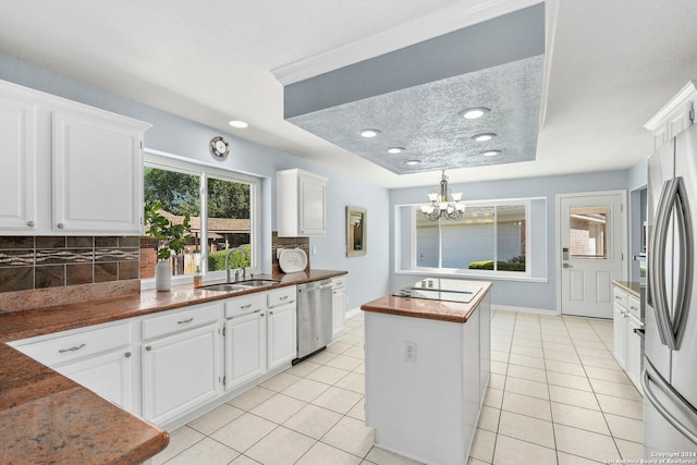 kitchen featuring tasteful backsplash, light tile patterned flooring, butcher block countertops, white cabinets, and appliances with stainless steel finishes