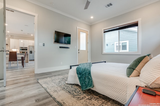 bedroom with ceiling fan, light wood-type flooring, stainless steel fridge with ice dispenser, and ornamental molding