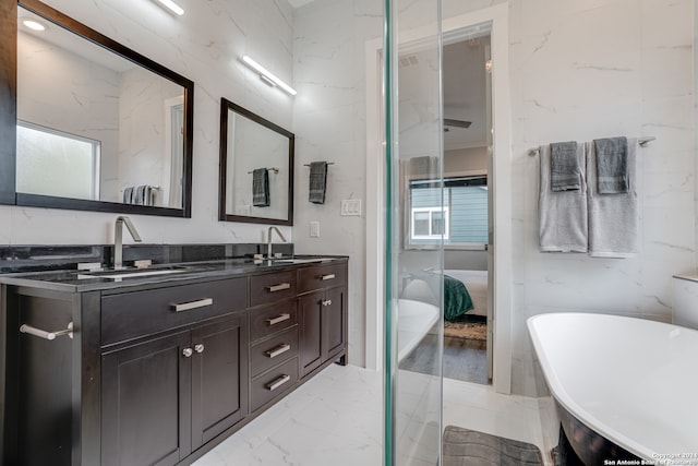 bathroom with vanity and a bathtub