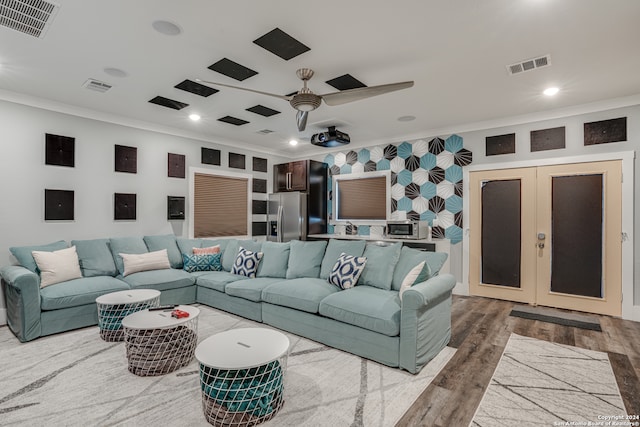 living room with hardwood / wood-style floors, french doors, sink, crown molding, and ceiling fan