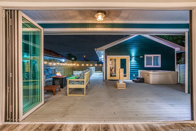 view of patio with a wooden deck and french doors