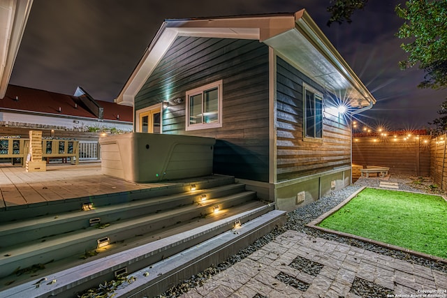 view of side of property featuring a deck