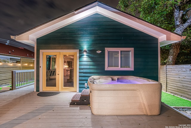 exterior space featuring french doors and a hot tub