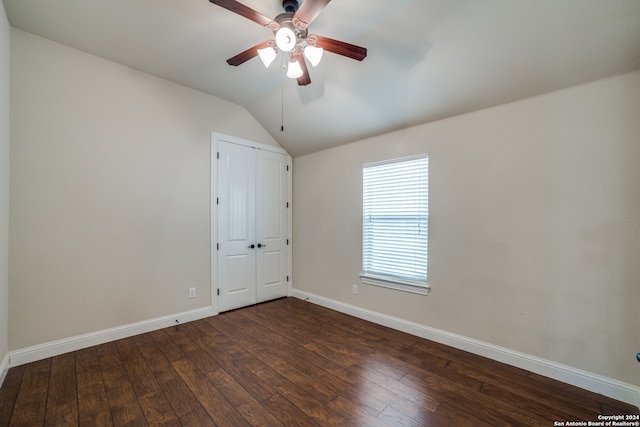 unfurnished room featuring dark wood-type flooring, ceiling fan, and lofted ceiling