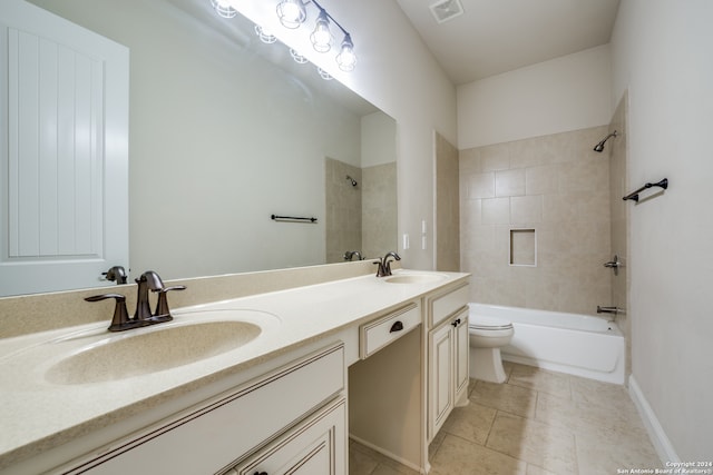 full bathroom with tile patterned floors, vanity, toilet, and tiled shower / bath