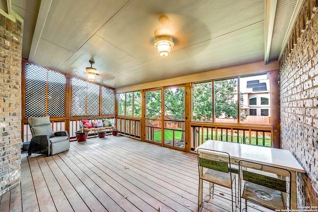 sunroom / solarium with ceiling fan