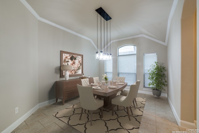 dining room with vaulted ceiling and ornamental molding