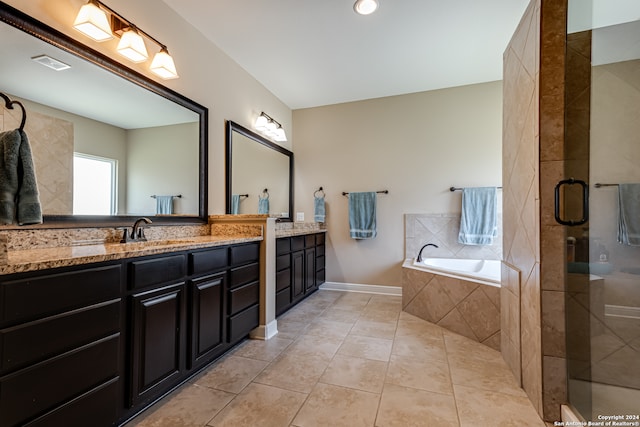 bathroom featuring tile patterned flooring, vanity, and independent shower and bath