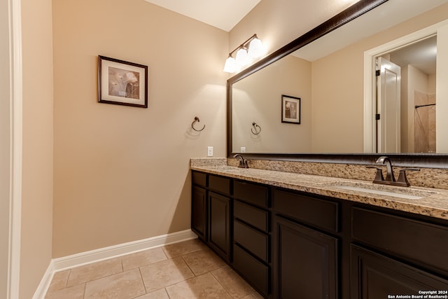 bathroom with tile patterned floors and vanity