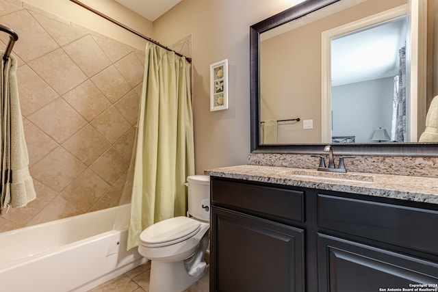 full bathroom featuring tile patterned flooring, vanity, shower / tub combo, and toilet