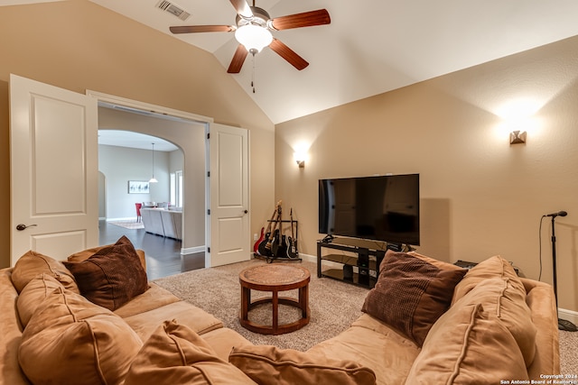 living room with ceiling fan, wood-type flooring, and vaulted ceiling