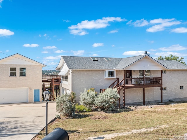 exterior space with a garage and a front lawn