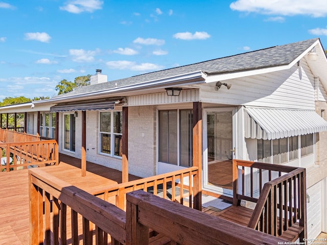 deck with a sunroom