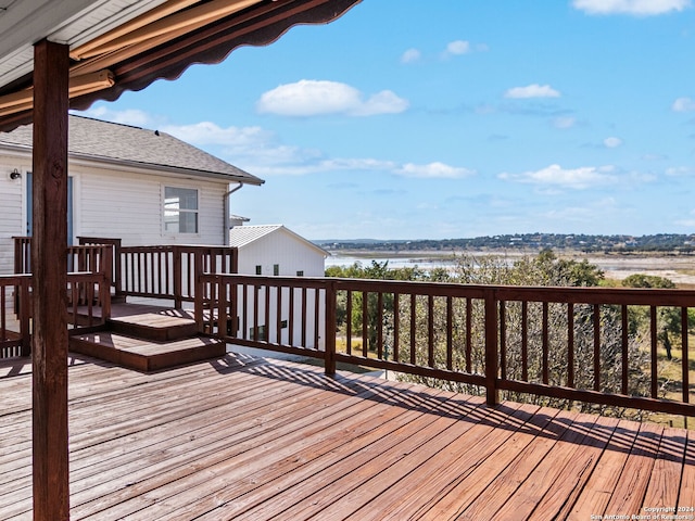 wooden terrace with a water view