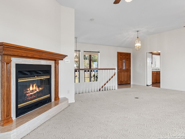 unfurnished living room featuring light colored carpet