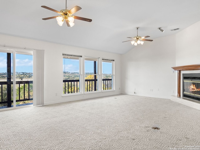 unfurnished living room featuring carpet flooring, ceiling fan, and high vaulted ceiling