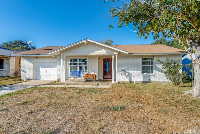 ranch-style house featuring a garage and a front lawn