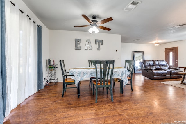 dining area featuring dark hardwood / wood-style flooring and ceiling fan