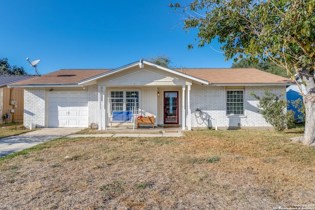 single story home with a garage and a front lawn