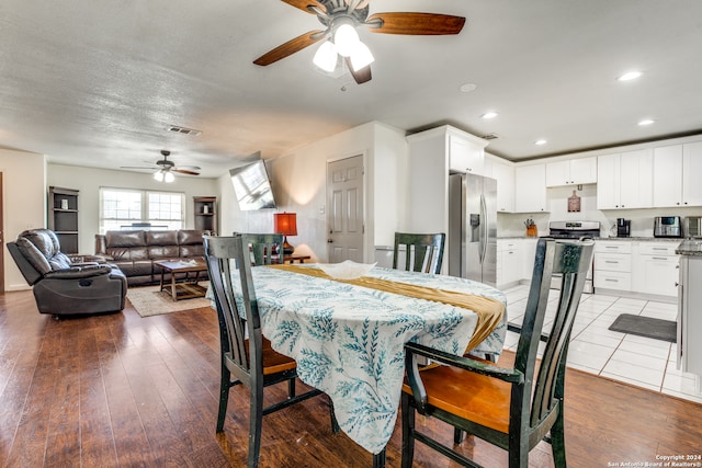 dining space featuring hardwood / wood-style floors and ceiling fan