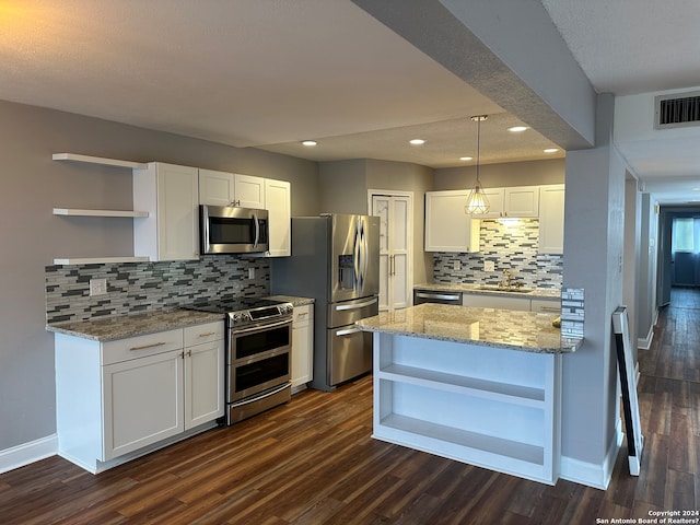 kitchen with white cabinetry, dark wood-type flooring, pendant lighting, and appliances with stainless steel finishes