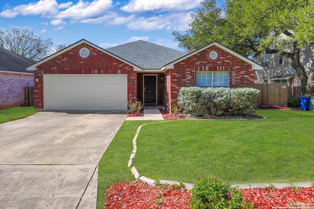 view of front of house with a front yard and a garage