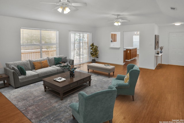 living room with ceiling fan and wood-type flooring