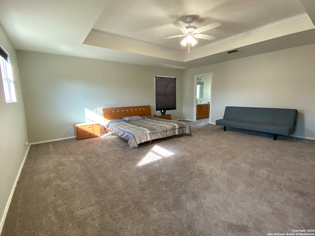 bedroom with carpet flooring, ceiling fan, a raised ceiling, and ornamental molding