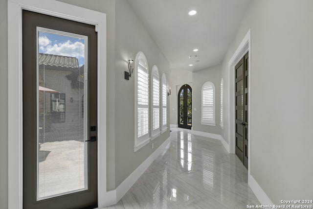 corridor featuring a wealth of natural light