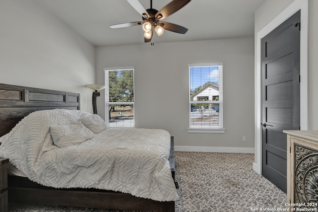 carpeted bedroom with ceiling fan