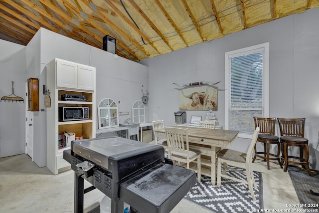 dining space featuring lofted ceiling