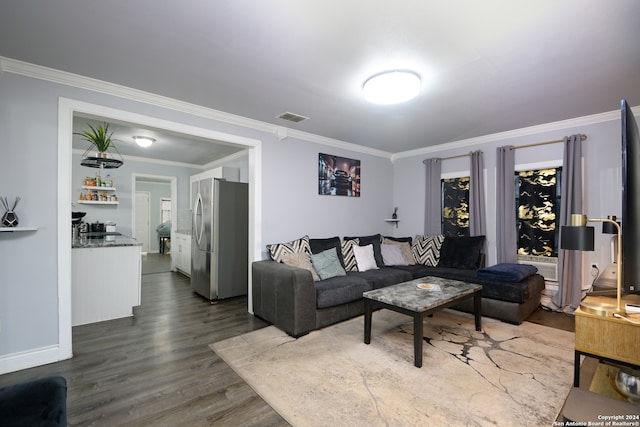 living room with hardwood / wood-style floors and ornamental molding