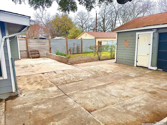 view of patio / terrace featuring an outbuilding