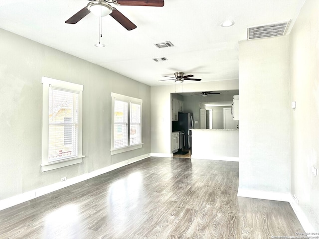 unfurnished living room featuring wood-type flooring