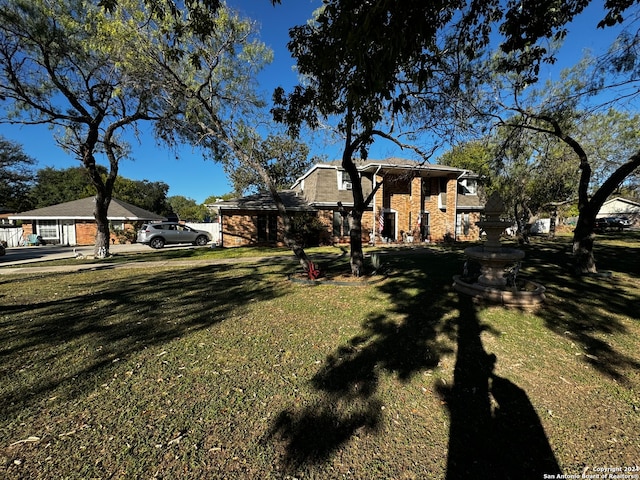 view of front of house with a front lawn