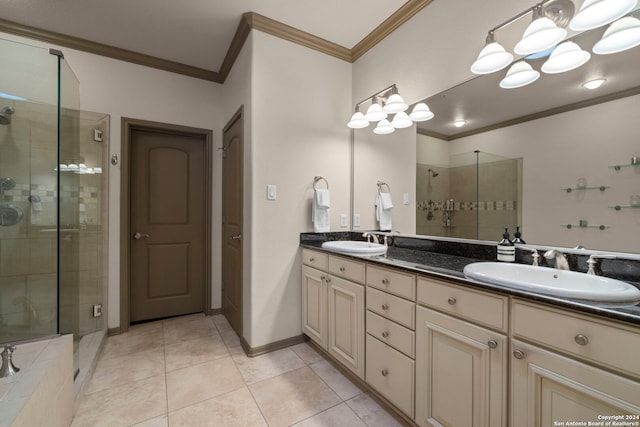 bathroom with crown molding, tile patterned flooring, vanity, and a shower with shower door