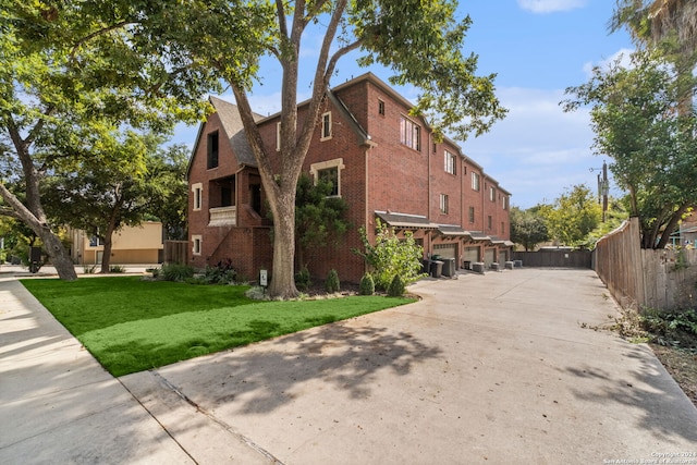 exterior space with a yard and a garage