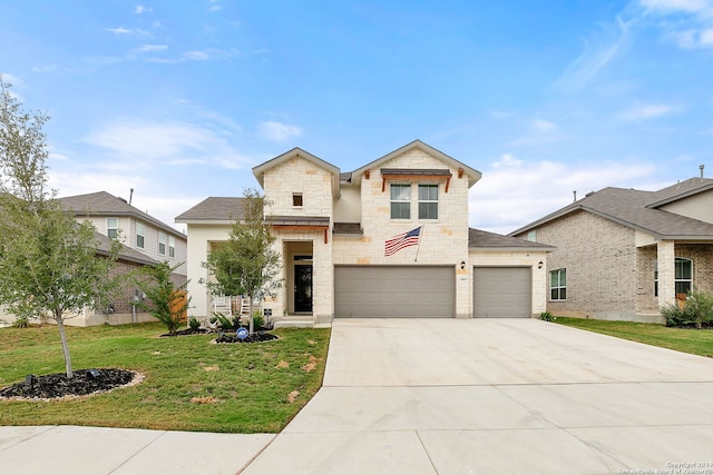 view of front facade featuring a front lawn and a garage